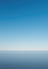 Obraz premium A peaceful, expansive, wide-angle view of a seamless horizon line where the vast blue sky meets a soft, empty, featureless ground plane ,vast ,endless ,conceptual