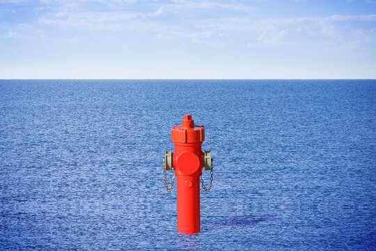 An improbable hydrant at the seaside. Plenty of water concept image