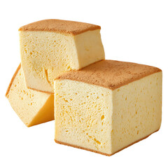 Three golden-brown topped, porous light yellow sponge cake blocks, stacked neatly on black