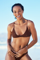 African portrait, bikini and woman at sea for summer vacation, travel adventure and wellness in nature. Female person, happy smile and swimwear for beach holiday, tropical island and peace in Cairo
