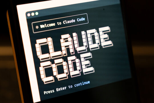 Warsaw, Poland - Feb 3, 2026: Digital screen displaying Welcome to Claude Code with pixelated text. Represents technology and programming culture in modern digital environments.