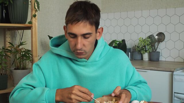 a man has dinner at home after work