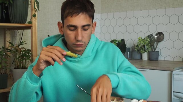 a man has dinner at home after work