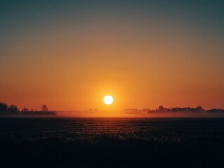 serene sunset over flat landscape with clear horizon and silhouettes of distant trees concept of tranquility nature and outdoor beauty