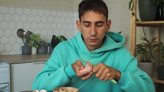 a man has dinner at home after work