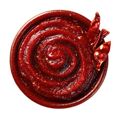 Vibrant red spicy sauce with chili flakes swirled in a bowl, garnished with dried peppers