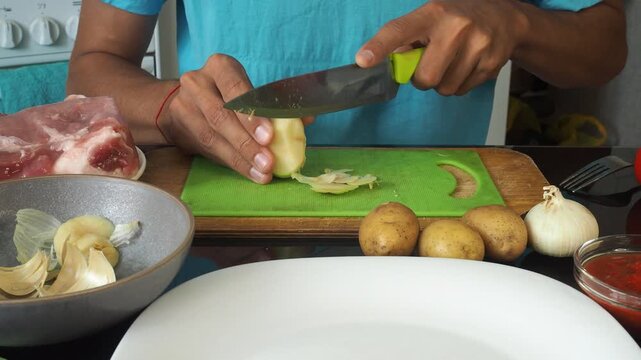 a man cooks dinner after work