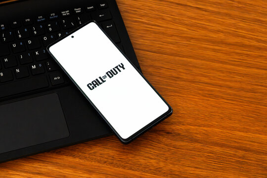 Punta Arenas, Chile &ndash; February 04, 2026: Iconic Call of Duty franchise logo displayed on a mobile phone screen resting on a laptop keyboard