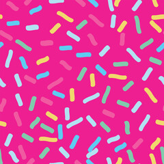 Multicolored sprinkles on pink icing seamless vector pattern. A fun print for holidays and bakeries. Cute abstract donut icing endless background.