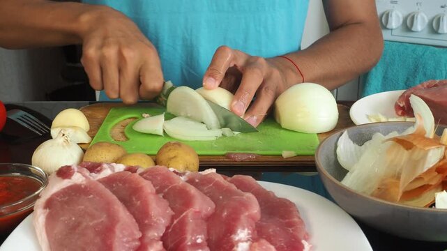 a man cooks dinner after work
