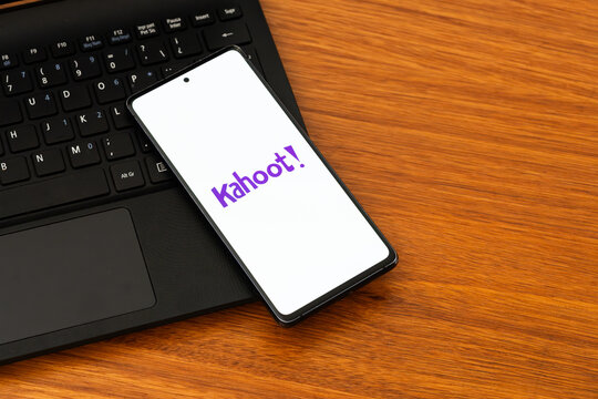Punta Arenas, Chile &ndash; February 04, 2026: Iconic purple Kahoot! logo displayed on a mobile phone screen resting on a laptop