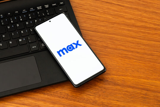 Punta Arenas, Chile &ndash; February 04, 2026: The Max streaming service logo on a mobile phone screen resting on a laptop