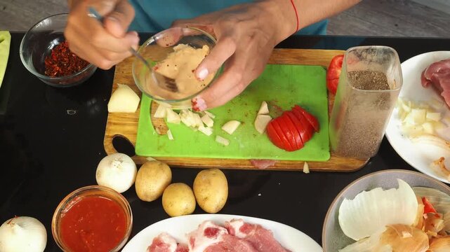 a man cooks dinner after work