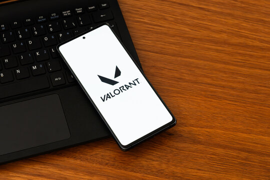 Punta Arenas, Chile &ndash; February 04, 2026: A smartphone displaying the Valorant "V" emblem and wordmark logo on a white screen, resting on a black laptop keyboard