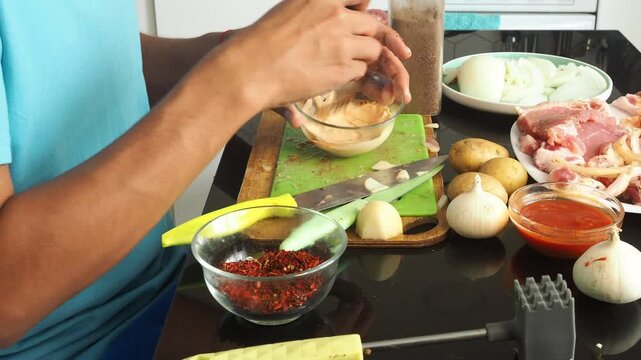 a man cooks dinner after work