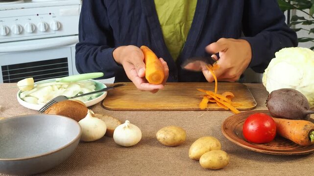 A man is preparing borscht with cabbage