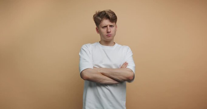 Person expresses different emotions in front of a plain background during a short activity in a studio