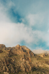 Fototapeta premium Arid rough steep rocky slopes of mountains in low altitude clouds. Nijar, Almeria, Andalusia, Spain.