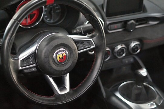 Abarth 124 Spider interior showing steering wheel and dashboard