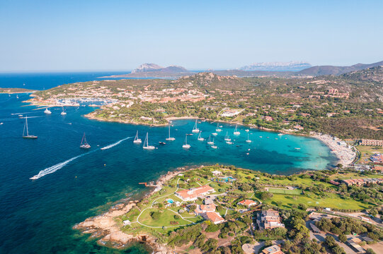 Aerial view of Porto Rotondo bay with sailboats and turquoise water, Olbia, Sardinia, Italy