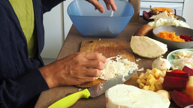 a man making egg sandwiches for breakfast