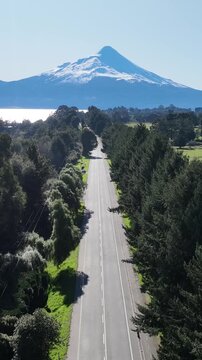 Patagonia Road At Puerto Octay Los Lagos Chile. Highway Interchange Crossing City With Traffic Jam. Snowflakes Lake Patagonia Landscape Exploring. Snowflakes Forest Trees. Puerto Octay Los Lagos.
