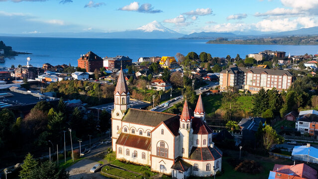 Osorno Volcano In Puerto Varas Los Lagos Chile. Snow(Capped Volcano Releasing Plumes Of Smoke Into Blue Sky. Snowing Day Lake Swiss Alps Snow Mountain. Snowing Day Nature. Puerto Varas Los Lagos.