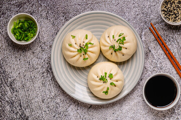 Dumplings on a plate with chopsticks and soy sauce