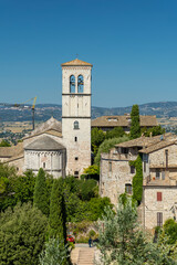 Assisi bell tower rising above historic houses