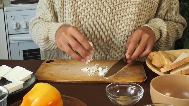 a man making egg sandwiches for breakfast