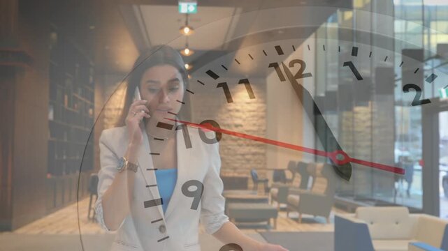 Business woman taking call in lobby, coordinating meeting while clock graphic shifting hands