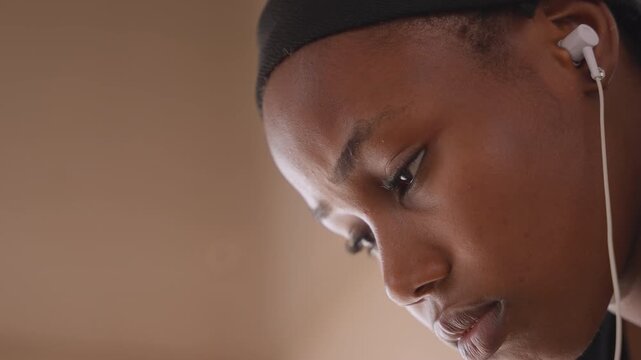 Closeup of woman engaged with audio content. Intimate depiction of woman deeply immersed in musical enjoyment. Portrait of woman focused and absorbed in listening to sensory audio stimuli