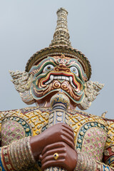 Fototapeta premium Majestic blue Yaksa guardian statue at the Grand Palace, Bangkok, Thailand.