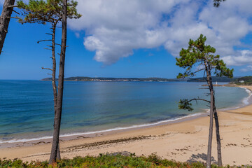 A serene coastal landscape with a sandy beach