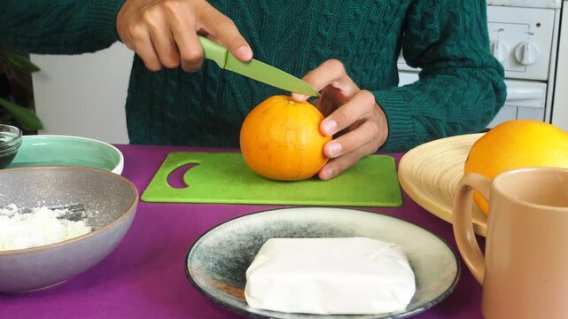 a man preparing a fruit dessert