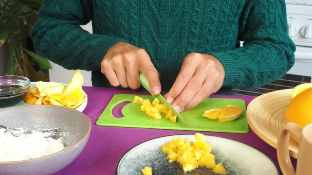 a man preparing a fruit dessert