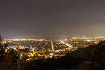 Fototapeta premium Athens City Night Panorama with Illuminated Streets, Greece