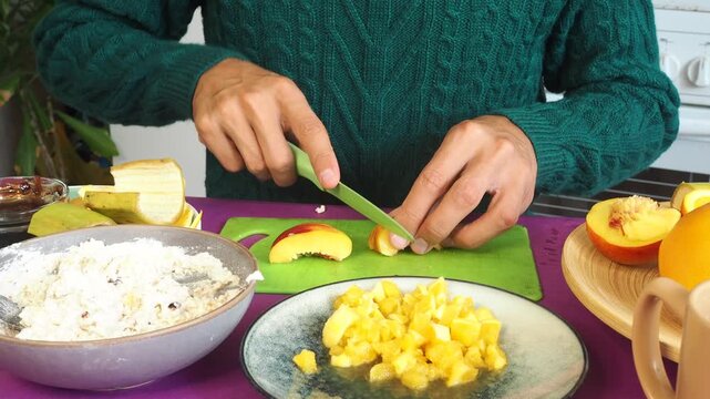 a man preparing a fruit dessert
