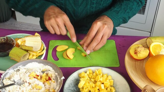 a man preparing a fruit dessert