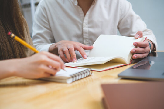 Young students campus helps friend catching up and learning.