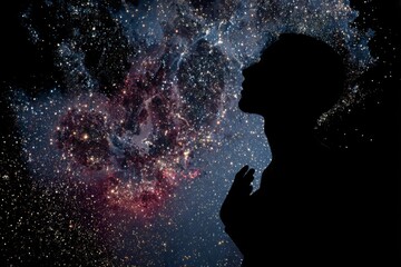 A silhouette of a person in profile stands with hands near the chest and looks up at a bright star filled cosmic background.