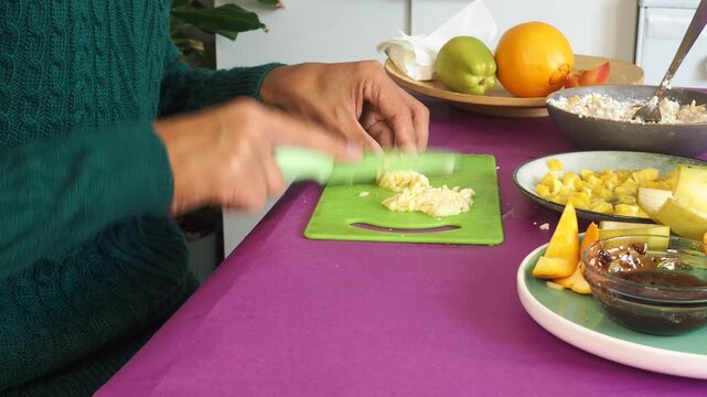 a man preparing a fruit dessert