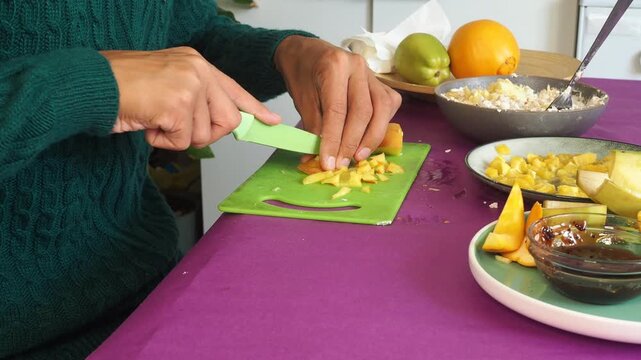 a man preparing a fruit dessert
