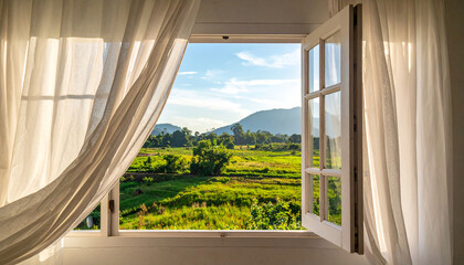 Open window with white curtains blowing in the breeze overlooking a lush green landscape and distant mountains under a clear blue sky. © Fawitra