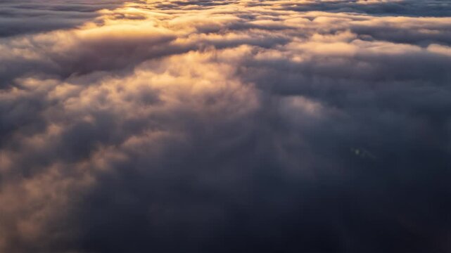 Foggy Clouds Flowing Like a River Above Forest Nature at Colorful Sunrise, Aerial Timelapse