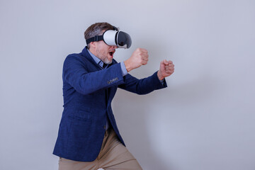 Fototapeta premium Man playing virtual reality game, experiencing immersive digital world, wearing vr headset and actively engaging in simulation