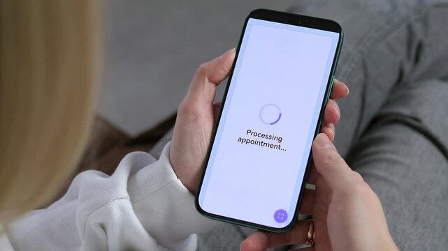 A high quality over-the-shoulder shot of a young woman using a modern healthcare mobile application to schedule a blood test. She selects a time slot, clicks the booking button, and receives an