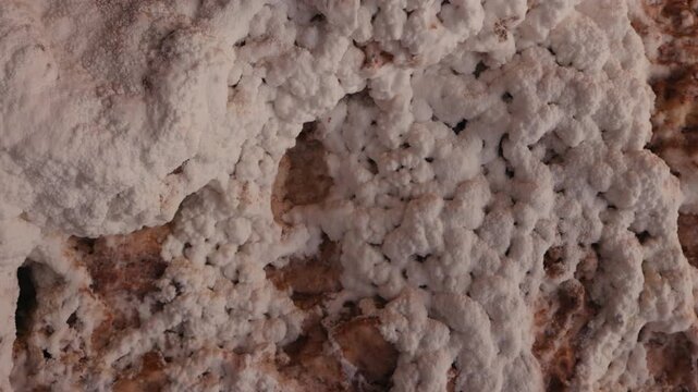 The walls of the salt cave on Qeshm Island with textured mineral walls and crystalline. Unique geological landscape and underground travel destination. one of the seven wonders of the Persian Gulf.
