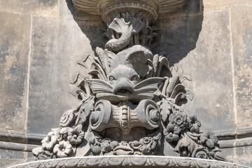 Naklejka premium Dresden.Germany.06.10.2025 Classical stone fish relief on ancient building facade niche.