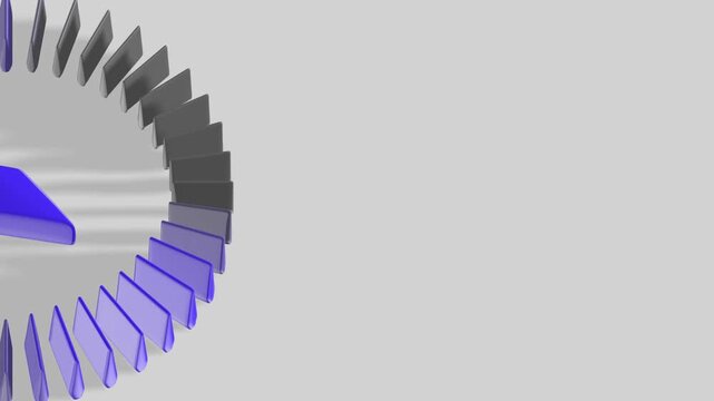 Zoomed-in view of blue and gray 3D tiles forming part of a stylized compass in circular pattern showing detailed structure and design with shadows on light background